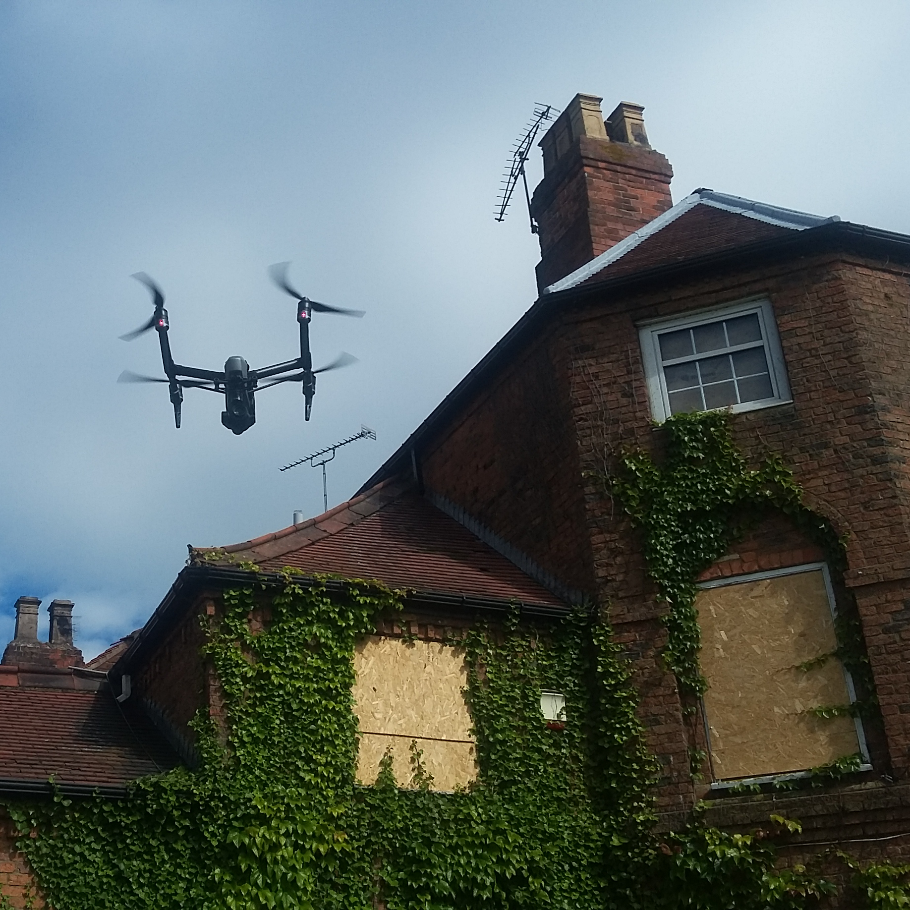 Drone flying over old building